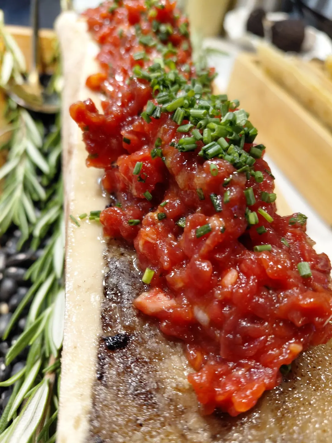 Steak tartare served on a split, roasted marrow bone
